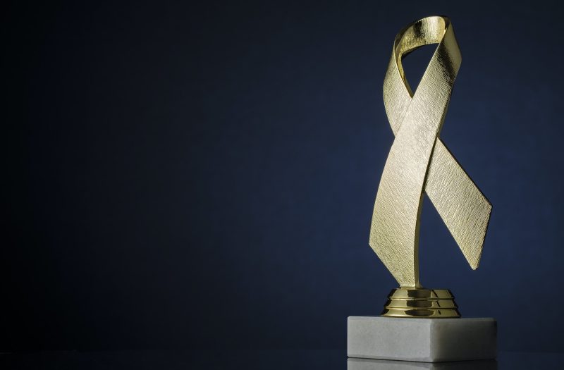 symbolic-textured-gold-ribbon-trophy-award.jpg